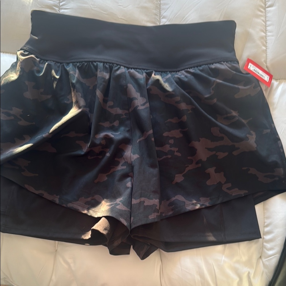SPANX Black Athletic Shorts with Layered Design and Moisture-Wicking Fabric